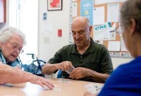 Elderly people playing cards