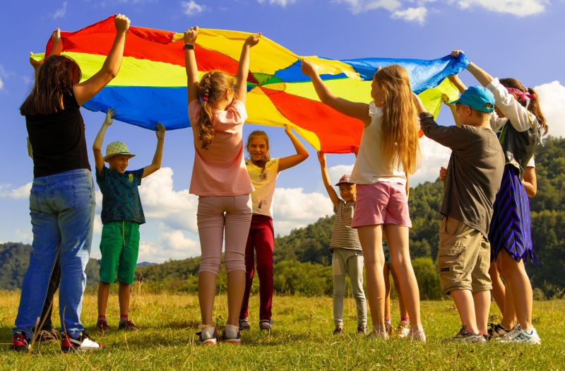 kids playing parachute games at youth group